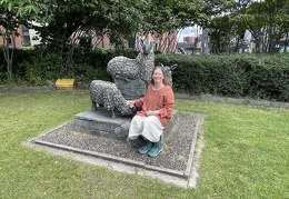 Sarah Petting Sheep Statue