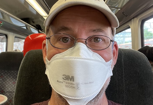Rick Masks Up for Train Ride to Manchester