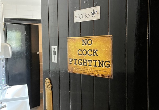 Humorus Sign on Gent's Door